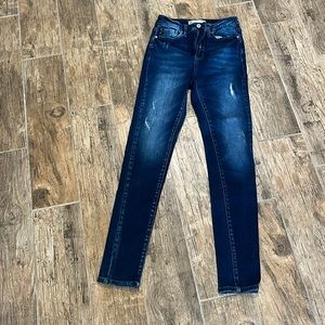 KanCan dark wash skinny jeans. Size 26, small rips